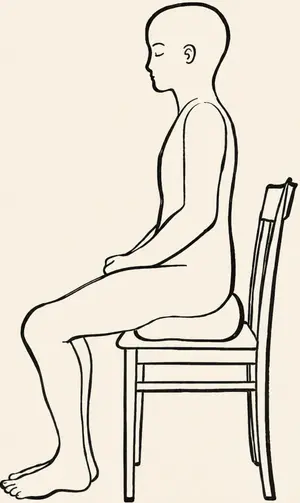 Side view of a person meditating upright on a chair